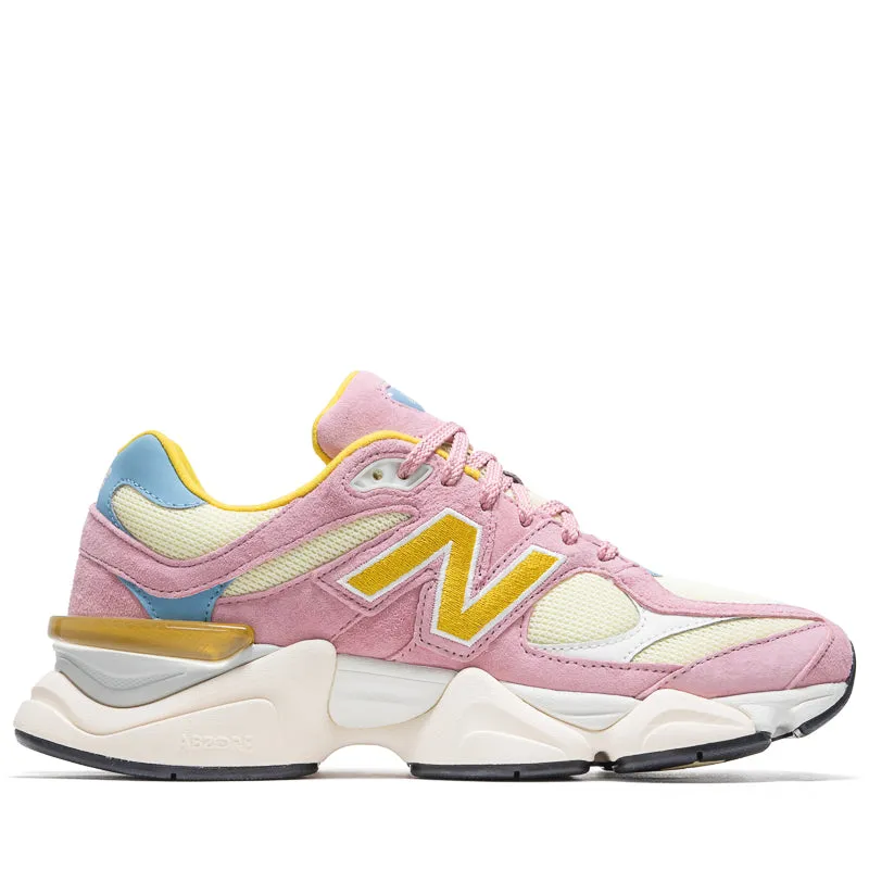 New Balance 9060 - Pink Taffy/Calcium anime - themed running shoes running in a famous bridge area shoes