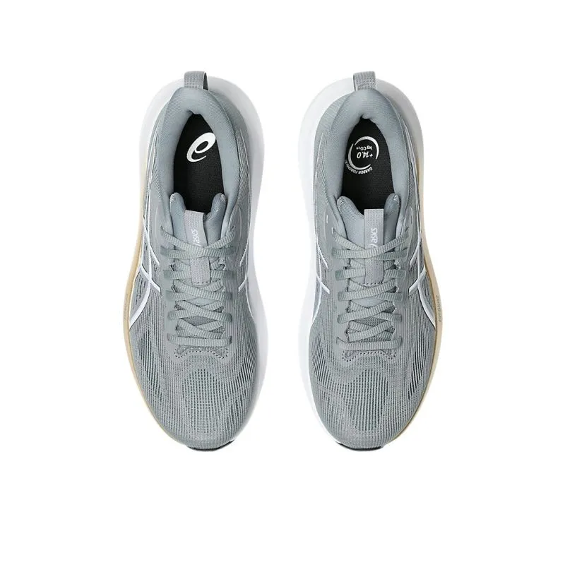 ASICS GT-1000 14 D WIDE Womens Running Shoes running on a gravel road