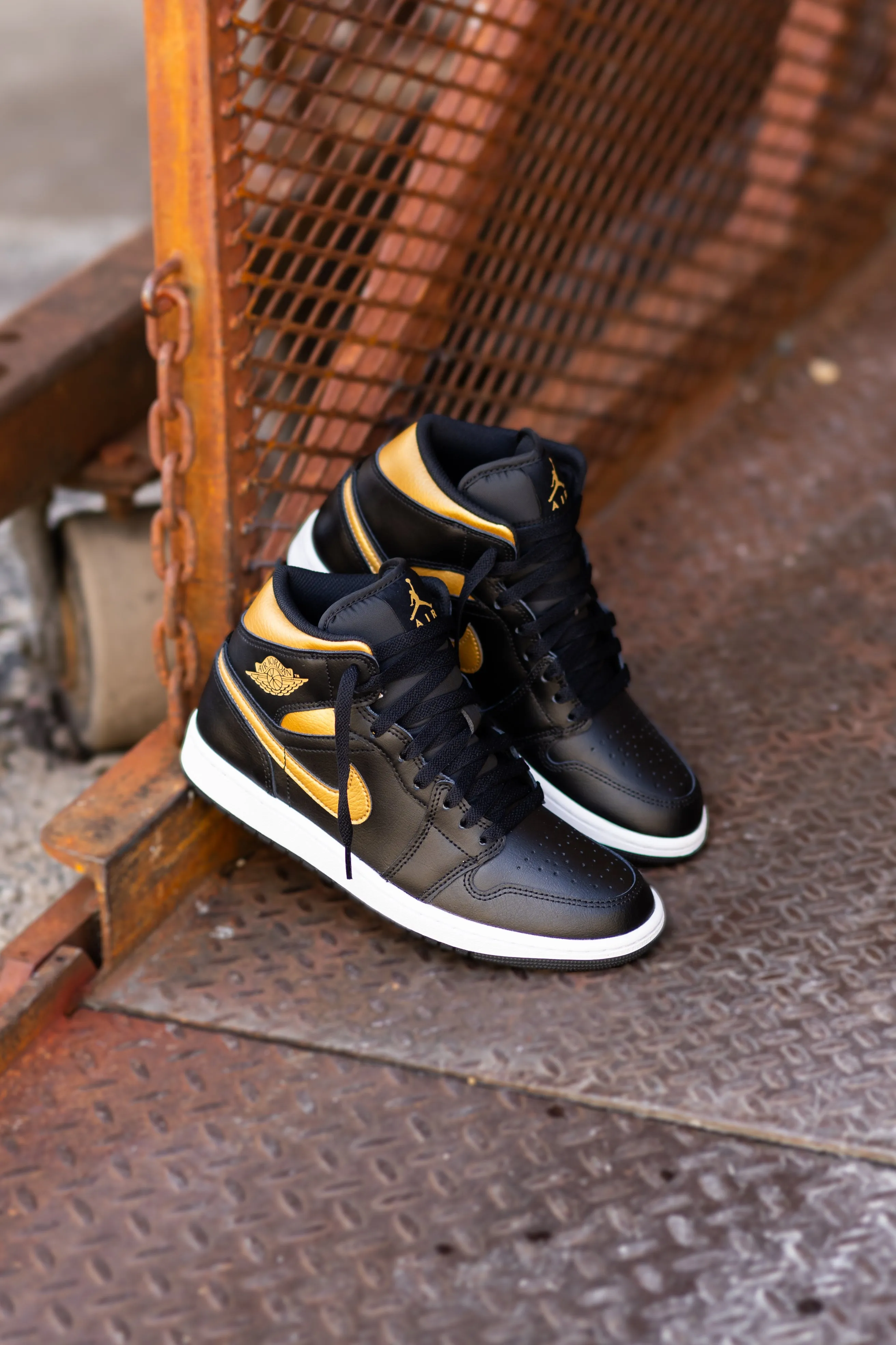 Outstanding triathletes Mens Air Jordan 1 Mid (Black/Metallic Gold/White)